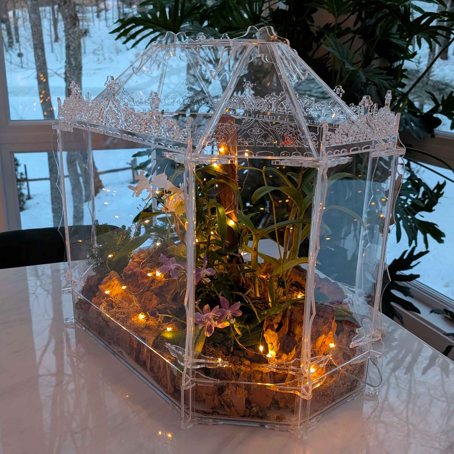 Side view of the handcrafted Victorian Gothic terrarium, inspired by the greenhouses of Hluboká Castle. Designed for orchids and tropical plants, featuring intricate acrylic detailing.
