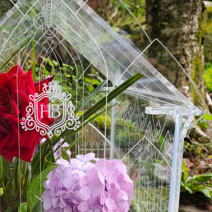Close-up view of intricate engraving and cutwork details on a Gothic-inspired terrarium, showcasing fine craftsmanship and ornate design.