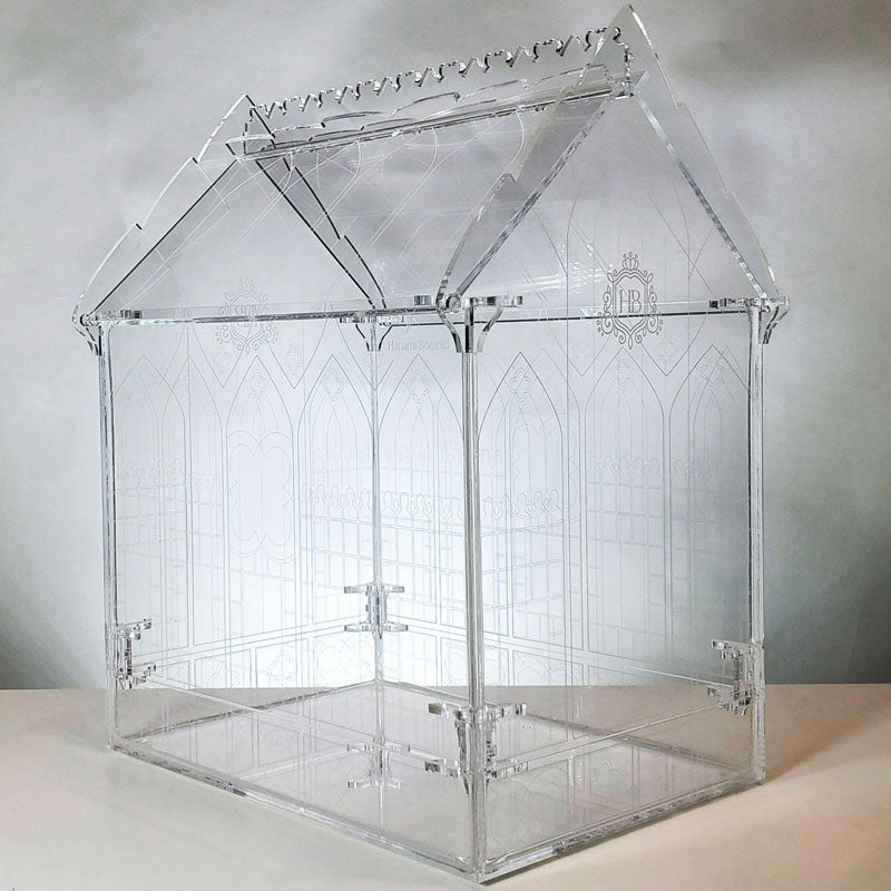 Full view of the Gothic-inspired terrarium in a studio setting, highlighting the detailed cutwork, engraving, and vibrant plant arrangement, showcasing its beauty and craftsmanship.