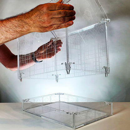 Showing how to remove the top section of the Gothic-inspired terrarium, providing easy access for plant care and maintenance, ensuring a healthy growing environment.